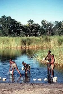 00945 Collection: Botswana children wash in the Okauango Delta Msi