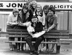 Bouquets for Huyton policeman David Henderson from local shop keepers