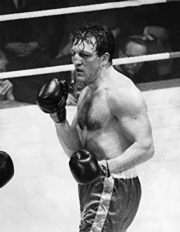 Boxer Brian London seen here losing to Henry Cooper on pionts at the Kings Hall