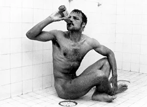 Drink Prints: Boxer John Conteh drinking beer in the shower December 1978