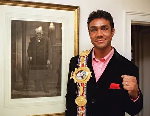 Boxer Kevin Lveshing at home in Westerham standing next to picture of Sir Winston