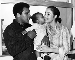 Boxer Mohammad Ali with his wife Veronica and 1 year old baby Hanna leaving Heathrow