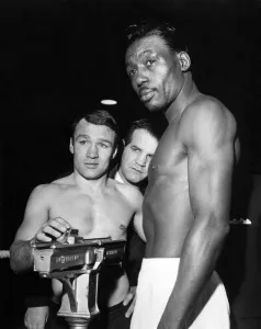 Boxing Belle Vue. Dave Charnley checks the scales for Joe Brown at the weigh in