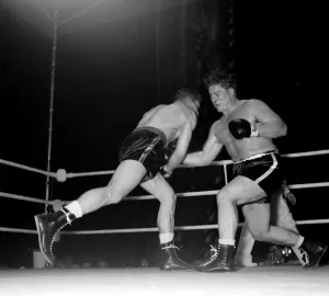 Boxing Don Cockell British and European Heavyweight Champion lands a right to the midrift