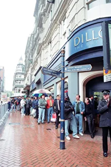 Queue Prints: Boxing fans queue outside Dillions book store in Birmingham to see Muhammad Ali