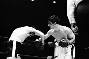 Boxing match between Jimmy Tibbs (white shorts) v Franco Macchia