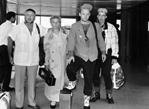 00028 Prints: Boy George Pop Singer of Culture Club flies back into the UK from a holiday in Barbados