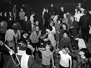 Young Prints: Where boy meets girl on their night out. Teenagers twisting at Dennistoun Palais