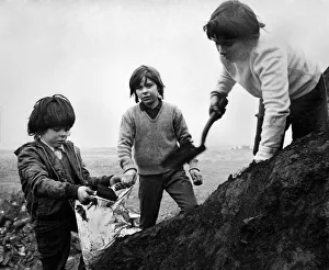 Boy miners digging for coal in the old mine at Cobridge North Staffordshire