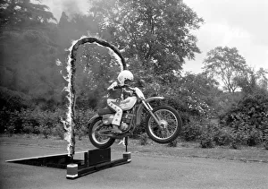 Stunts Prints: Boy Stunt Rider: 6 year old Darius Goodwin is pictured here leaping through flames for