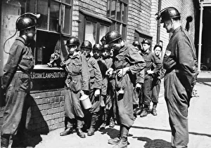 Miners Prints: Boy trainees get their lamps before going below to the Ashington Colliery Company