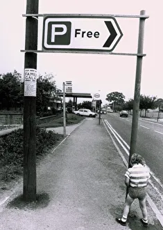 1979 Prints: A boy urinating on a free parking sign - Pee for free! Humour