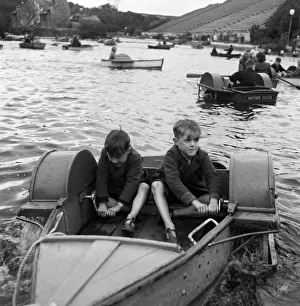 Coast Prints: Two boys in a boat, at the boating lake at Northstead Manor Gardens in Scarborough