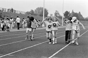 Images Dated 20th June 1979: Boys and girls tied together as they take part in the Three Legged race at their school