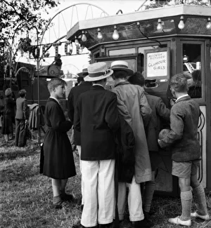 00021 Prints: Boys at Henley queue to look at what the butler saw machine'. July 1953 D3393