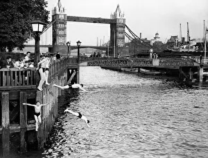 River Prints: Boys jumping off the bank of the River Thames into the water near Tower Bridge, London