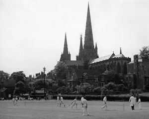 Boys playing cricket in the shadow of Lichfield Cathedral at St