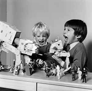 00717 Prints: Two boys, Thomas (dark hair) and Robbin playing with their Star Wars toys
