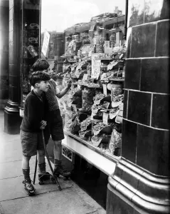 Century Prints: Boys visit a local sweet shop as the end of sweet rationing is enforced. 22nd April 1949