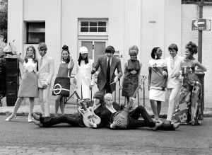 Brazilian fashion in London. Brazilian model posing with pop group The Move