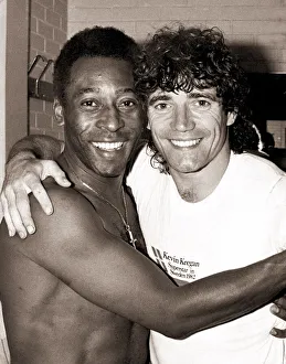 Brazilian football legend Pele embraces England striker Kevin Keegan