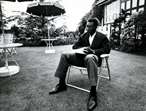 Chair Prints: Brazilian football star Pele relaxes in an English country garden at the Brazilian team