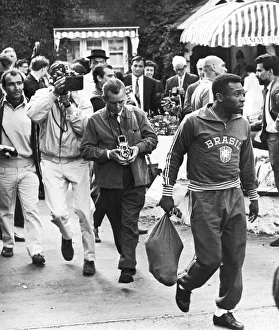 Photographer Prints: Brazilian football star Pele surrounded by photographers