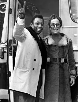 Brazilian football star Pele with his wife Rosa as he arrives in London to play football