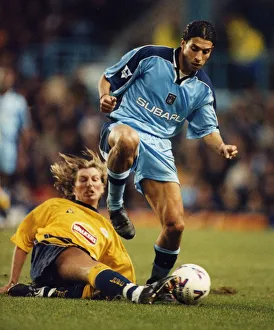 00340 Prints: Breaking away: Youssef Chippo is challenged by Robbie Savage