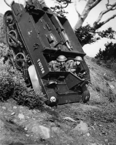 Exercises Prints: A Bren Gun Carrier makes an almost vertical drop down a hazardous spot during British