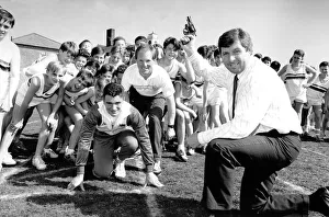 Brendan Foster, watched by Paul Ponton (centre) and Royal Grammer School sprinter Jason