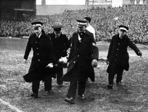 00241 Prints: Brian Clough is carried from the field by the St John Ambulance Brigade after injuring