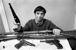 Brian Entwistle with his son, Nigel (5) and his collection of guns - a hand-reproduction