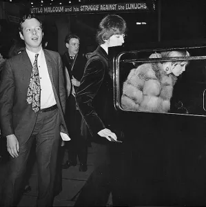 Brian Epstein, George Harrison and Pattie Harrison leave the Garrick Theatre, London
