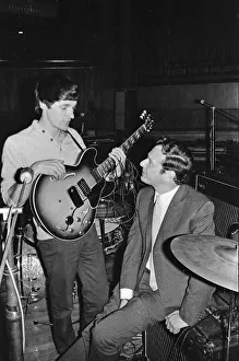 Commonwealth Prints: Brian Epstein (right) talks to a guitarist from one of the British bands appearing