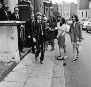 Brian Jones of The Rolling Stones leaves court after being remanded on bail