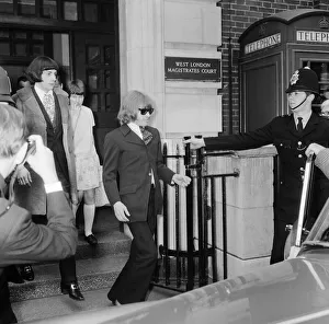 Bands Prints: Brian Jones of The Rolling Stones leaving court with Prince Stanislaus Klossowski de Rola