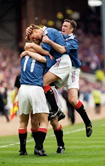 Brian Laudrup Rangers football player is mobbed by skipper Richard Gough