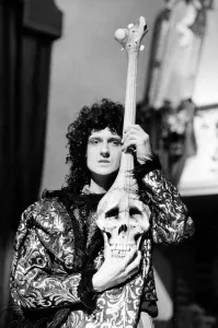 Guitars Prints: Brian May of the Queen Rock Group during the filming of Its A Hard Life