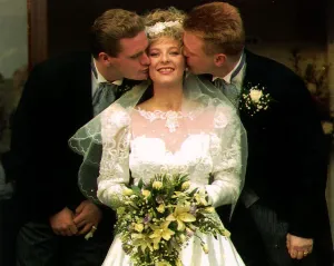 Bride Anna Marie Gascoigne receives a kiss from her brother footballer Paul Gascoigne