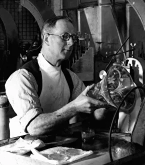 Craftsman Prints: Brierley Hill Glassworks 1st April 1952 Ernie Rowley engraving a vase in the works