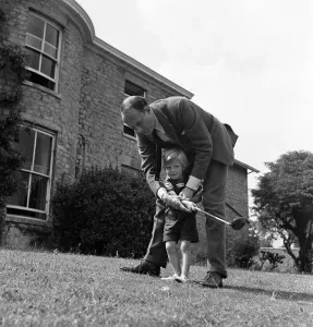 01288 Prints: Brigadier Fitzroy Maclean playing with his son Charles in their garden at home in Yealand