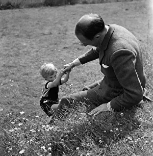 1949 Prints: Brigadier Fitzroy Maclean playing with his son Charles at home at Yealand Conyers
