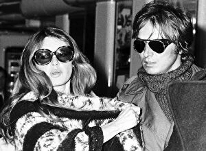 Images Dated 29th March 1976: Brigitte Bardot actress with her lover sculptor Miroslav Brozak at Heathrow airport Dbase