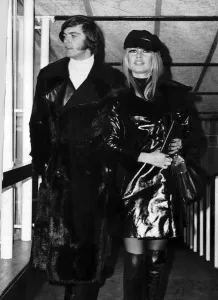 Brigitte Bardot French actress with Patrick Gilles walking through the lounge at Heathrow
