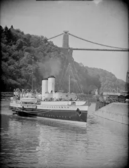 Tourists Prints: The Bristol Queen paddle steamer seen here closes to the Clifton Suspension Bridge Circa