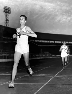 Finish Prints: Britain v Russia Athletic Meeting: White City: London. Gordon Pirie finishes in grand