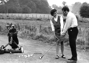 Britains first female golf instructor Peta Morgan giving a lesson at High Elms