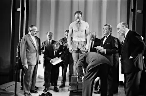 Britains Henry Cooper weighs-in for his non title bout against Cassius Clay aka
