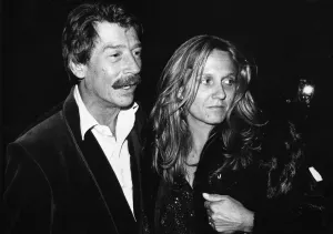 British actor John Hurt arrives at the Royal Albert Hall in London with his wife Donna to